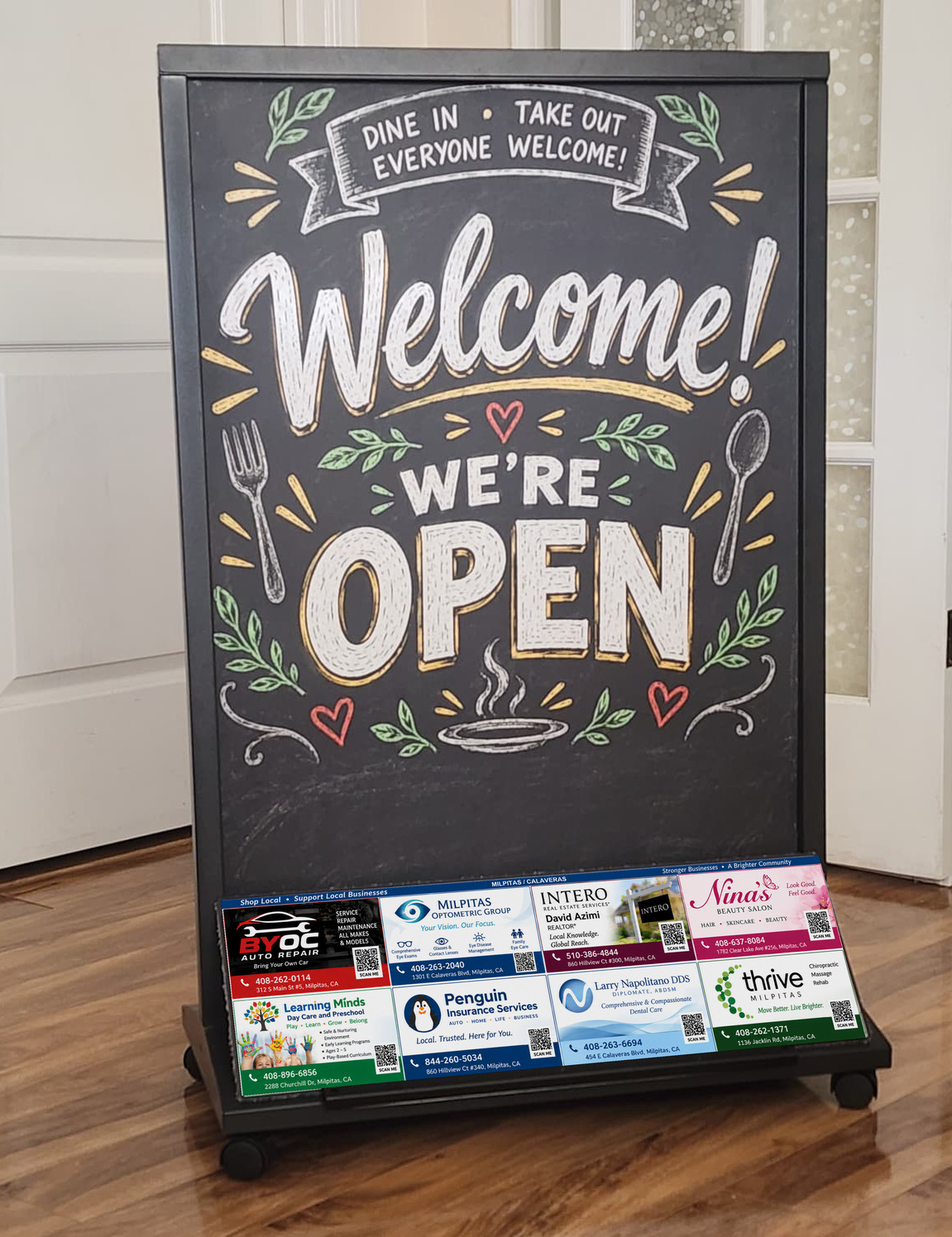 The finished board on its rolling stand, with the eight-business sponsor panel attached